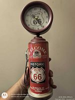 Front angled view showing Route 66 graphics and clock face