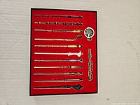 display box with 11 wands, pendant and clip