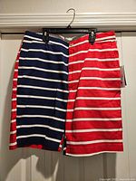 Front view showing half-red and half-navy striped design, size tag visible