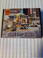 Front of boxed F.O Carlo's Chili Dog Trailer set showing artwork and set details