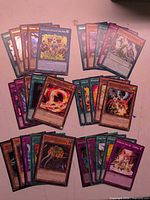 Spread of Yu-Gi-Oh cards showing multiple card groups and types