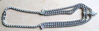 Full view of three-strand rhinestone necklace