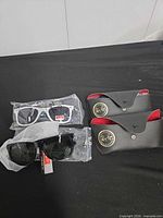All three sunglass pairs, two cases visible