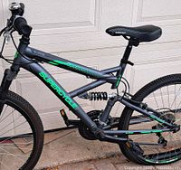 Right side profile of entire bike against garage door