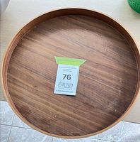 Top view of round walnut veneer tray