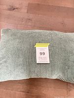 Top view of one ribbed corduroy pillow showing color and texture