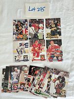 All 36 Donruss hockey cards laid out on cloth background, lot label visible