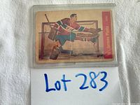 Front of Jacques Plante Parkhurst #15 card in plastic holder, showing playing action and Montreal Canadiens uniform