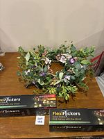 Wreath and two FlexiFlickers boxed sets on table