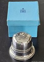 Closed ring box beside Birks outer box