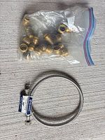 Overview of hose and bag of brass fittings