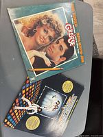 Front covers of Grease and Saturday Night Fever soundtrack albums