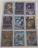 Front view of all 9 cards in top loaders