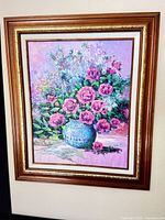 Frontal view of framed floral oil painting showing artwork and frame details