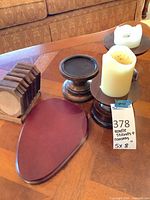 Group shot showing candle stands, faux candles, coaster set in holder, burgundy board