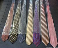 Front view showing all seven neckties in plastic sleeves