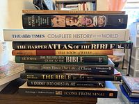 Stacked view of all ten hardcover books showing spines and titles