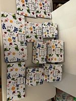 Stacked floral-print boxes showing quantity and uniform pattern of Maxwell & Williams Contessa series
