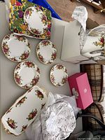 Overview of plates, serving tray and boxed teapot