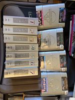 All DVD box sets laid out in bin, showing titles and condition