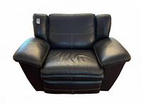 Front view of black leather reclining chair showing white stitching and pillow-top arms