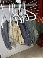 Six shorts on hangers in assorted colors