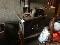 Front-left perspective showing stove body, dual doors and accessories on top