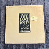 Front of gatefold jacket showing title graphic and moisture staining