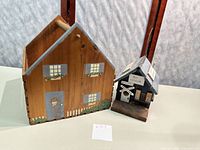 Two wooden houses side by side