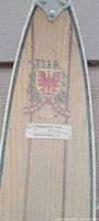Ski tip showing Tyro crest decal and Springhaven Club plaque