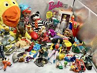 All items grouped displaying range of figures, plush, vehicles and keychains