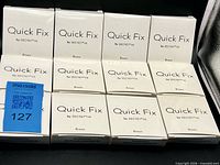 Front view of twelve Quick Fix by Secret YK boxes