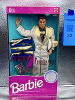 Front view of boxed Ken Sea Holiday doll and accessories
