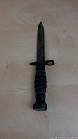 Full view of bayonet showing blade and handle front