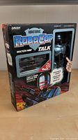 Front view of boxed Orion Audiotronic RoboCop action figure showing figure and accessory