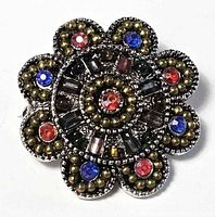 Front view of brooch showing full floral design and coloured rhinestones