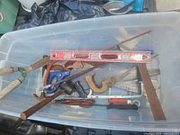 Overall view of tools inside clear plastic tote