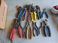All 13 hand tools laid out showing variety and condition