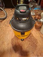 Full view of yellow Vac'n VAC 10-gal wet/dry vacuum