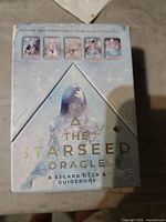 Front of The Starseed Oracle box showing title and wear marks