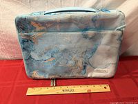 Front view of Mosiso laptop sleeve with handle and ruler for scale