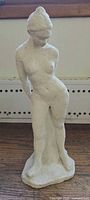 Full view of plaster female nude figurine