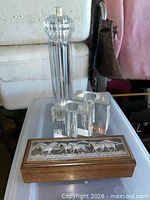 Group view of pepper mill, two bud vases, jewelry box