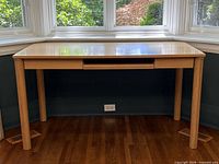 Front view of desk under window