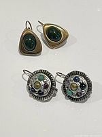 Both pairs of earrings front view on white background