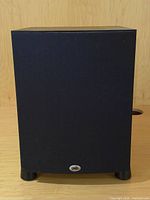 Front view of PSB SubSeries 200 subwoofer with grille attached