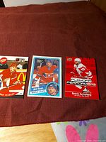 Three hockey cards laid out: Fedorov, Root, Zetterberg