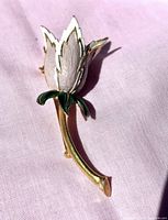 Front view of tulip brooch showing enamel petals and stem