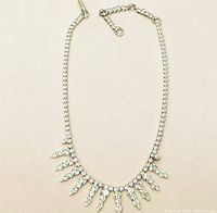 Full view of necklace on neutral background showing overall design