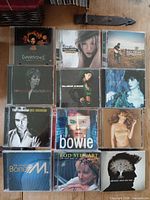 Front covers of all 12 CDs laid out in 3x4 grid